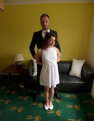 1 dark haired female tortures another during lezdom play in concrete cellar